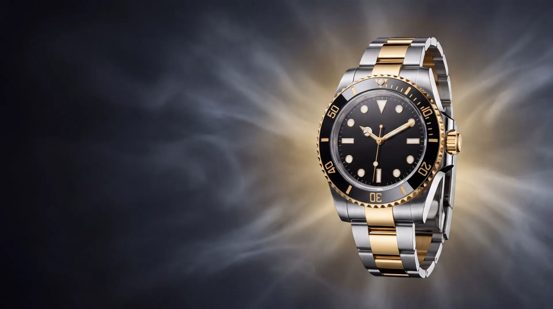 Two-tone steel and gold dive watch with black ceramic bezel in charcoal mist